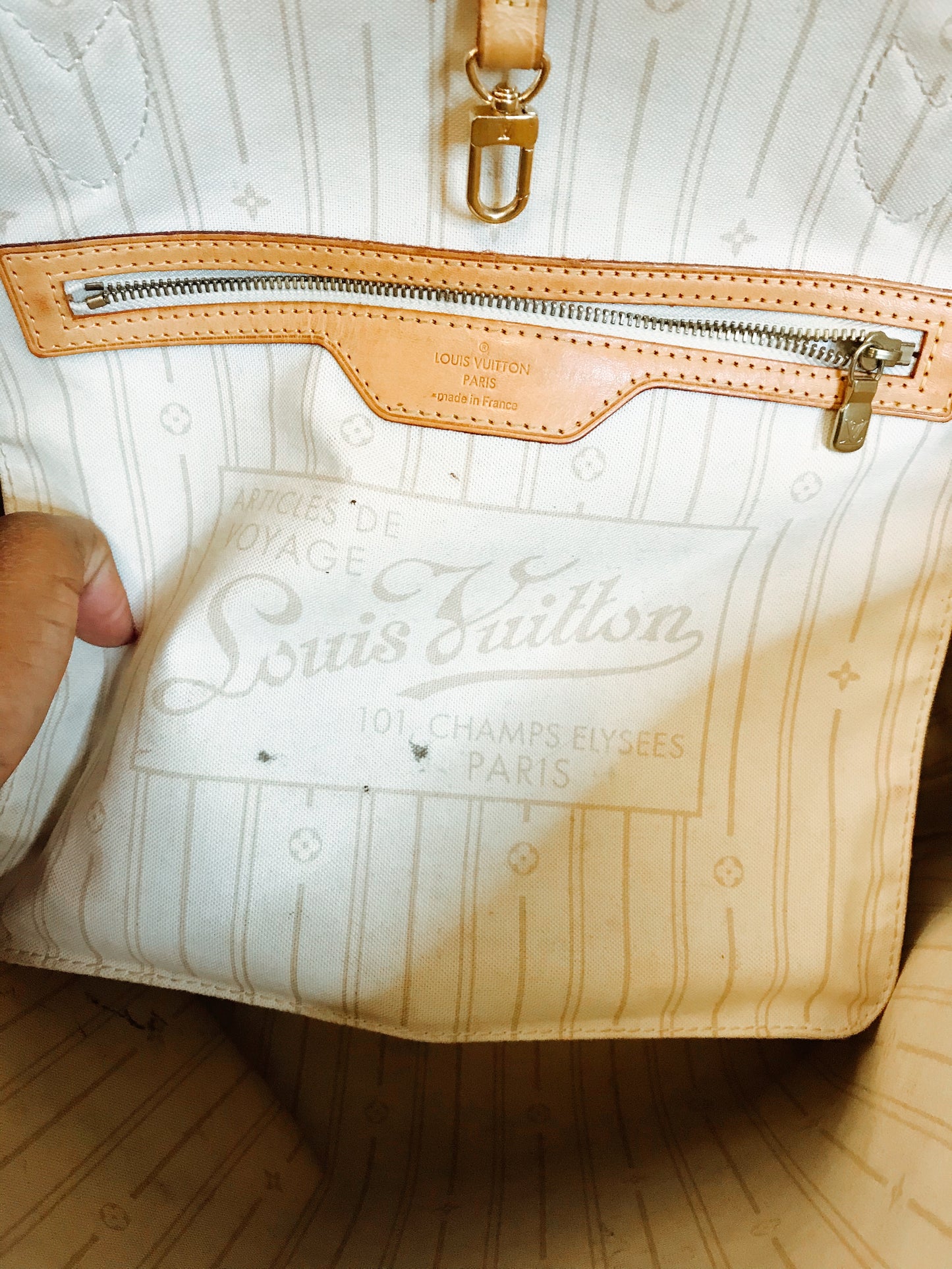 TWO ll: Louis Vuitton Neverfull Tote.